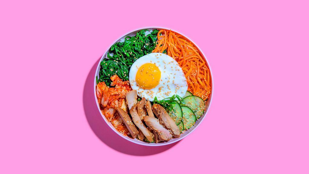 Chicken Bibimbap · Marinated chicken with white rice, kimchi, shredded carrots, cucumber, scallions, sesame seeds, fried egg, and gochujang.