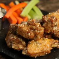 Garlic Parmesan · 8 garlic parmesan wings* (mild heat), and a choice of blue cheese, classic ranch, for dipping