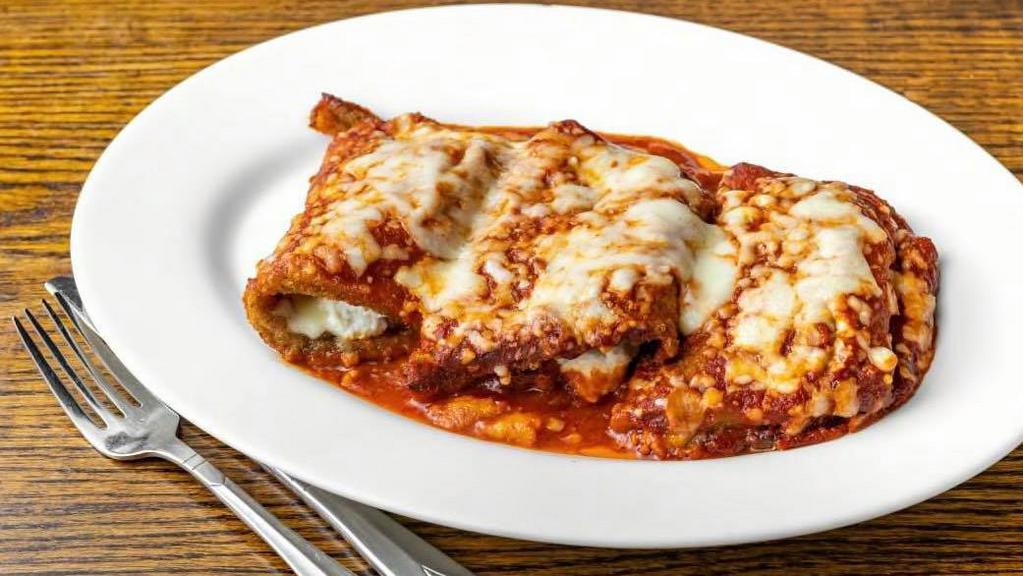 Eggplant Rollatini · Served with bread and pasta with traditional italian tomato sauce or garden salad.