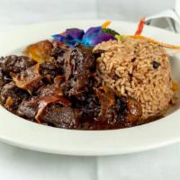Braised Oxtails · SERVED WITH RICE & PEAS & VEG.