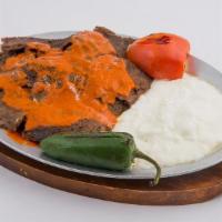 Iskender Kebab · Gyro kebab in a lightly hot tomato sauce. Served with bread crumbs.