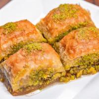 Baklava · Sweet pastry made of extremely thin sheets of phyllo dough layer with chopped nuts and honey...