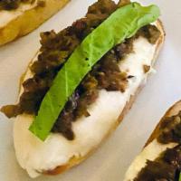 Goat Cheese Crostini · Olive Tapenade | Honey | Arugula (v)
