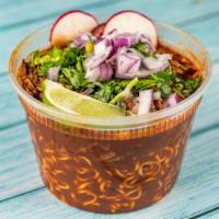 #5 Beef Birria Raman · Ramen Noodles in Consome topped with Birria, cilantro, and onions. Red salsa, green salsa an...