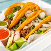 #1 Tacos · 4x Tacos garnished with cilantro and onions. Red salsa, green salsa and lime included. Add s...