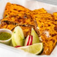 #4 Quesadilla · 12 inch Flour Tortilla stuffed with cheese, meat, cilantro and onions. Red salsa, green sals...
