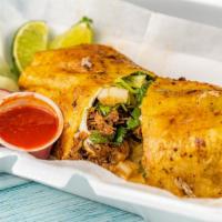 #6 Burrito · Stuffed Grilled Burrito with house blend cheese, meat, avocado, lettuce, cilantro and onions...