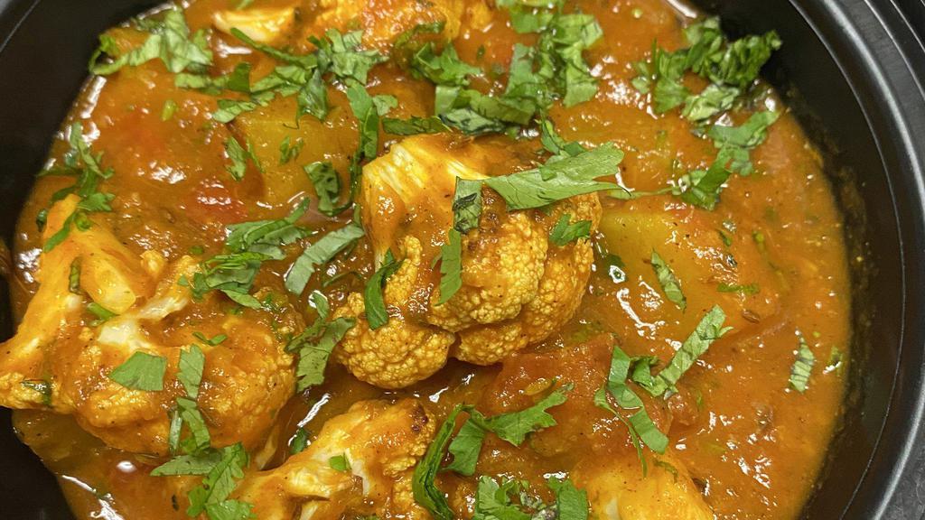 Potato Cauliflower (Aloo Gobhi · This is a traditional wholesome North Indian dish made from potato, cauliflower, spices in onion tomato curry.