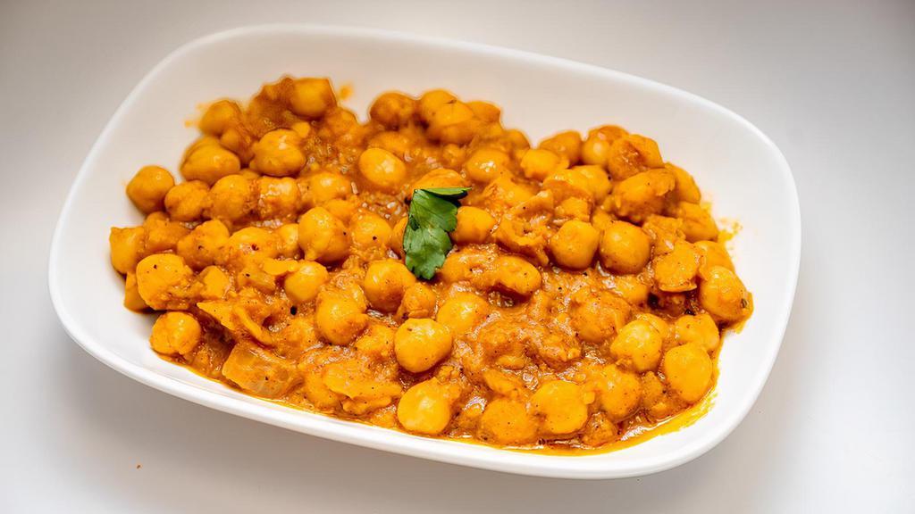 Chickpeas Potato (Aloo Chole) · Potato (aloo) and garbanzo beans ( chole) cooked in traditional spices, onion and tomato in a home cooked style.