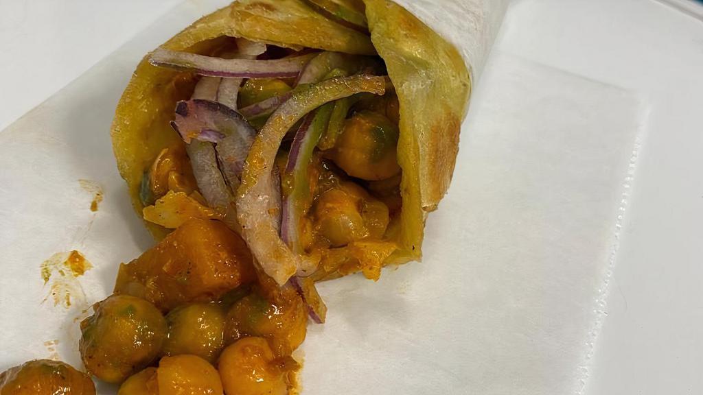 Spicy Chickpeas & Potato Roll · Vegetarian. Chickpeas with tomatoes, fenugreek, and blackening spices wrapped in paratha or roti.