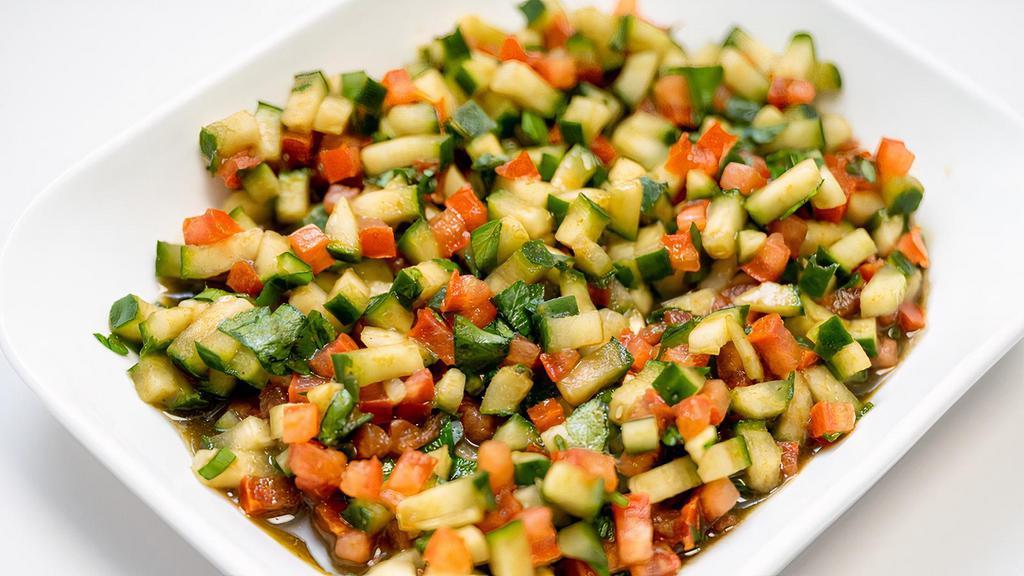 Kachumber Salad · Small. Sweet-tangy tomatoes, crunchy cucumbers and piquant onions go well with almost any Indian dish. Having some fresh, raw veggies with your meal or as a meal with tandoori plant-based chicken for an additional charge.