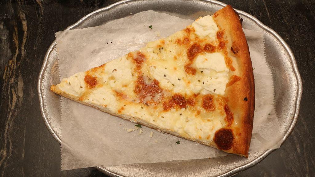 White Pizza · Crispy round pie with shredded mozzarella, aged Parmesan and ricotta cheese.