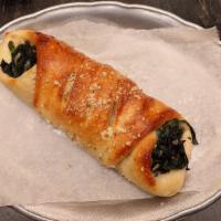Spinach Roll · Pizza dough rolled with spinach, mozzarella and ricotta cheeses. Served with side of fresh m...