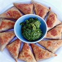 Sambosa (Crispy Turnover - 4 Pieces) · Filled with chopped lamb, beef or vegetables seasoned with spices.