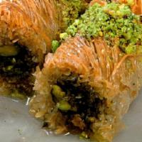 Konafee · Shredded dough roll filled with pistachios, walnuts and honey.