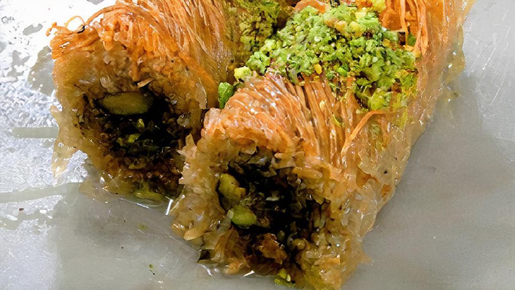 Konafee · Shredded dough roll filled with pistachios, walnuts and honey.