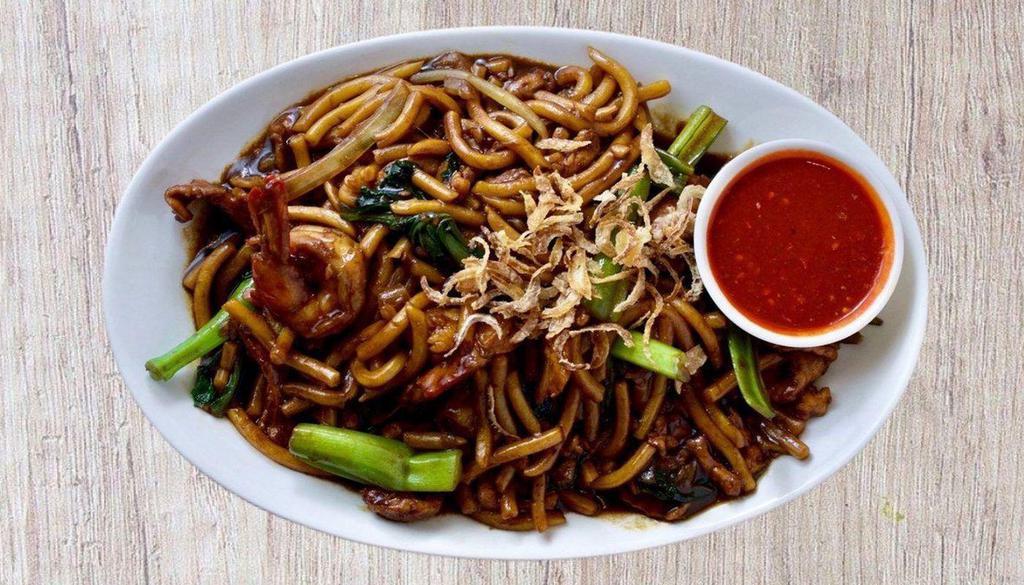 Kl Hokkien Char Mee 福建炒面 · Famous stir-fry hokkien thick egg noodles in rich aromatic dark soy sauce with shrimp, pork, calamari and bok choy.