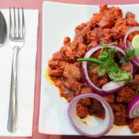 Hyderabadi Chicken 65 · Boneless cubes of chicken marinated with Indian spices, deep fried, and sautéed with slight ...