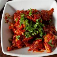 Gobi Manchurian (Gravy) · Cauliflower florets stir-fried in a work with soy sauce & green chilies.