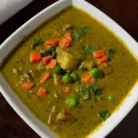 Aloo Palak · Potatoes and spinach finely chopped coriander cooked with turmeric & spices.