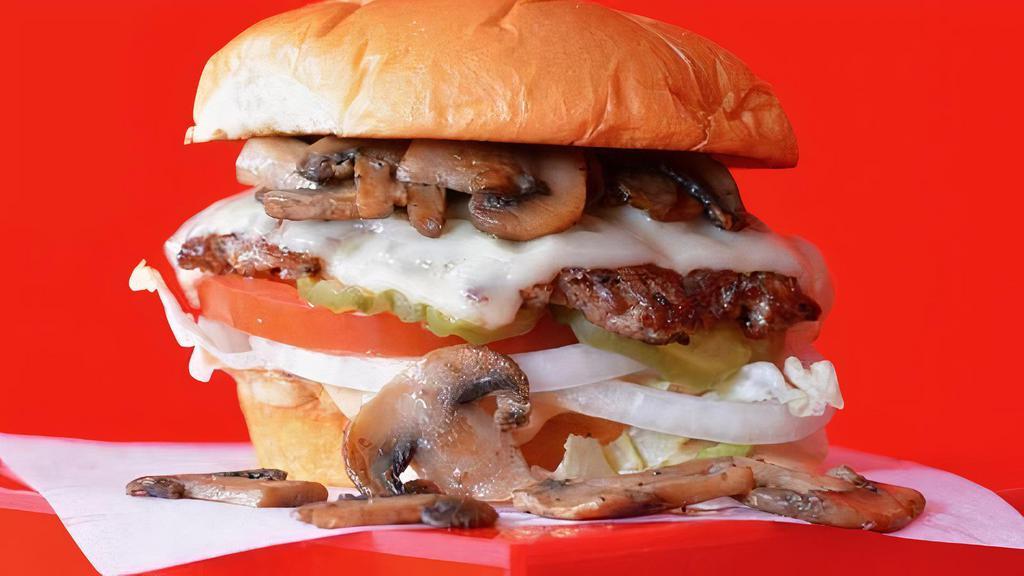 Bud'S Mushroom Swiss Cheeseburger · Juicy grilled beef burger smashed to perfection on a toasted potato bun with swiss cheese, grilled mushrooms, fresh lettuce, sliced tomato, pickles, onion and Super Smash Sauce.