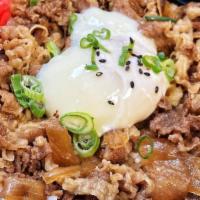 Gyudon · Thin sliced beef and onion in shoyu broth over rice topped with one onsen egg