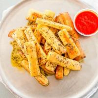 Garlic Bread Sticks · Smothered in garlic sauce and herbs with side of marinara sauce.