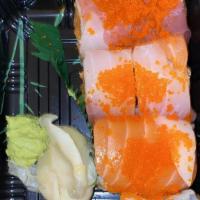 Sunshine Roll · Spicy tuna, salmon, white fish and avocado topped with tuna, salmon, white fish and tobiko.