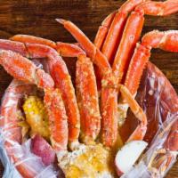 Snow Crab Leg · Served with corn, potatoes, and a choice of sauce.