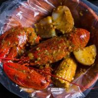 Lobster (Whole) · Served with corn, potatoes, and a choice of sauce.
