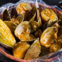 Boiled Little Neck Clam (1 Lb) · Served with corn, potatoes, and a choice of sauce.