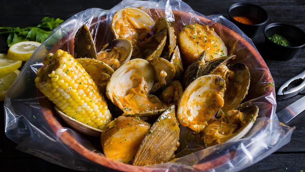 Boiled Little Neck Clam (1 Lb) · Served with corn, potatoes, and a choice of sauce.