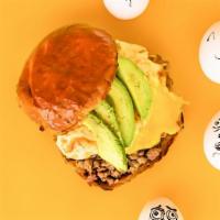 Sausage, Egg, Cheese, And Avocado · This sandwich is the best of the wurst. Sausage, scrambled eggs, cheese, avocado — all the m...