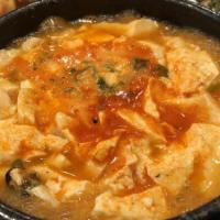 03 . Soft Tofu Soup 순두부찌게 · Seafood, pork, kimchi, beef, and spam.