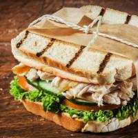 Shredded Chicken Sandwich · Delicious Sandwich made with Chicken cutlets, cheddar cheese, bacon, lettuce, tomato, and Ru...