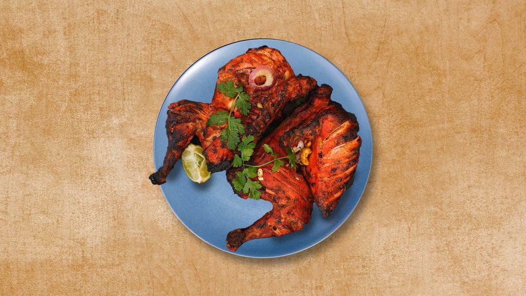 Chicken Torpedo · A smoky chicken appetizer prepared by roasting chicken marinated in yogurt and Indian spices in a cylindrical clay oven.