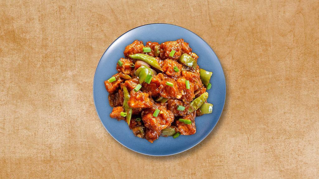 Chili Paneer · Stir-fried cottage cheese cubes wok-tossed in sweet-sour and spicy chili sauce with scallions, ginger-garlic, and bell peppers.