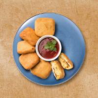 Cottage Cheese Fitters  · Cottage cheese cubes dipped in spiced gram flour batter and deep-fried till golden and crisp.
