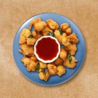 Fritter Voyage · Assorted seasonal veggies, diced, seasoned and dipped in spiced gram flour batter, and deep-...