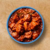 Classic Chicken Tikka Triumph · Chunks of roasted chicken cooked in onion tomato-based gravy and aromatic spices. Served wit...