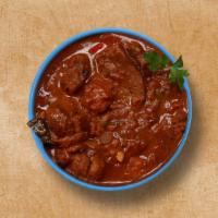 Lamb Legendary · Lamb meat is braised in a gravy flavored with garlic, ginger, and aromatic spices. Served wi...