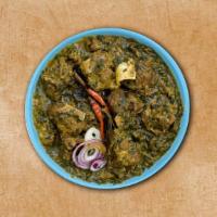 Spinach Lamb · Tender lamb pieces studded with blanched spinach in a cream-based gravy with fresh herbs and...
