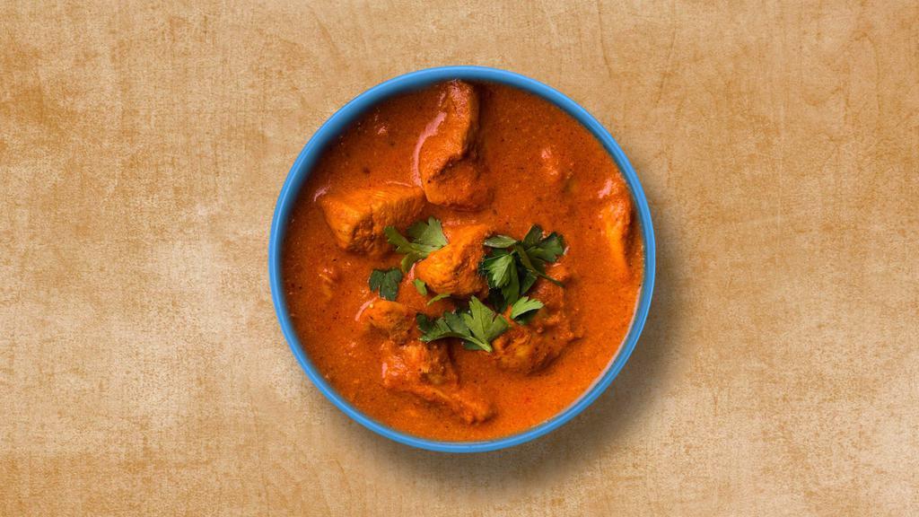 Ultimate Butter Chicken · Chunks of roasted chicken tossed in a creamy tomato cashew sauce with ground warm spices. Served with a side of rice.