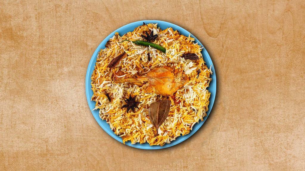 Chicken Biryani Theory · Basmati rice simmered in Indian spices with chicken chunks, fresh herbs and cooked in a special homemade Biryani Masala. Served with a side of yogurt relish.