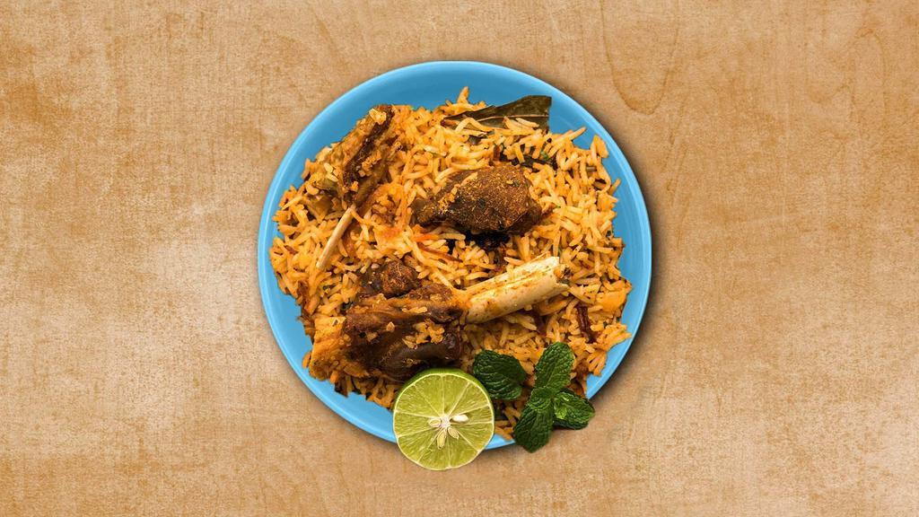 Lamb Biryani Theory · Basmati rice simmered in Indian spices with boneless lamb meat, fresh herbs and cooked in a special homemade Biryani Masala. Served with a side of yogurt relish.