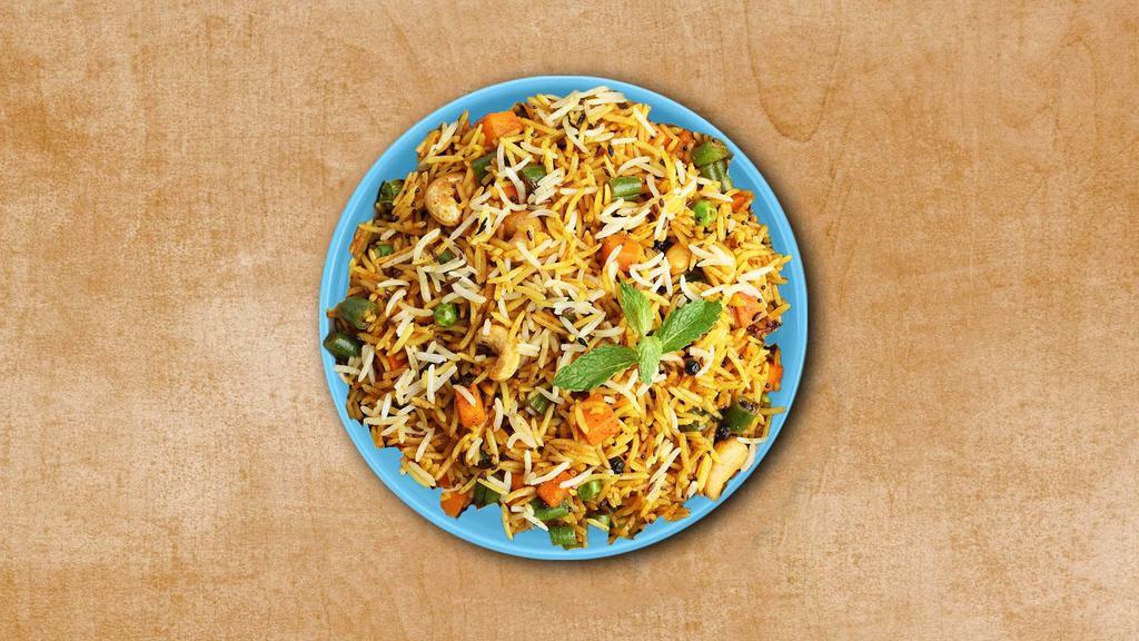Veg Biryani Theory · Basmati rice simmered in Indian spices with seasonal vegetables, fresh herbs and cooked in a special homemade Biryani Masala. Served with a side of yogurt relish.