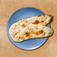 Simple Naan · A leavened flatbread baked in a clay oven. A perfect accompaniment to our entrees.