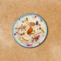 Rice Pudding  · Milk simmered with broken bits of basmati rice, sugar, chopped nuts, and flavorings.