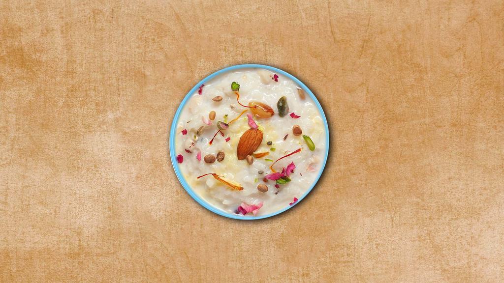 Rice Pudding  · Milk simmered with broken bits of basmati rice, sugar, chopped nuts, and flavorings.