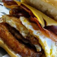 R 24- Belly Buster · Egg, Meat, Cheese and Hash Browns on a roll